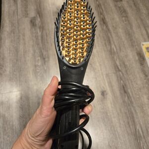 Sleek Black and Gold Hair Styling Brush